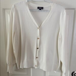 Elegant cream colored cardigan.  Beautiful gold buttons!